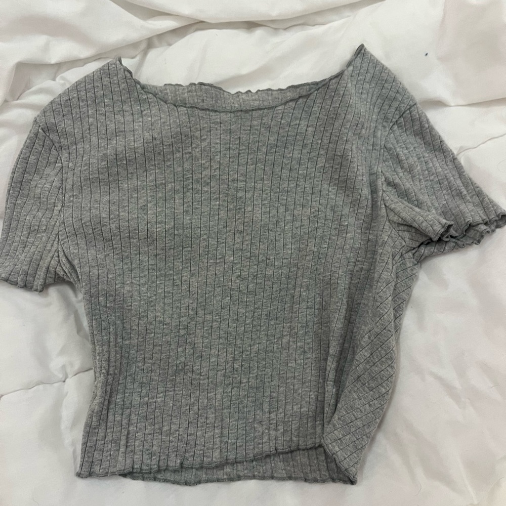 gray open neck shirt. not sold anymore